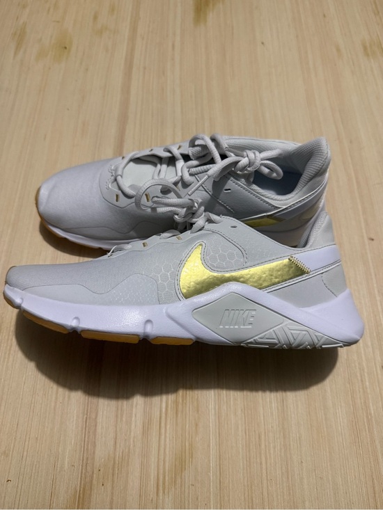 Nike Shoes - Nike Women's White Sneakers with Metallic Yellow-Gold Swoosh. NWOT